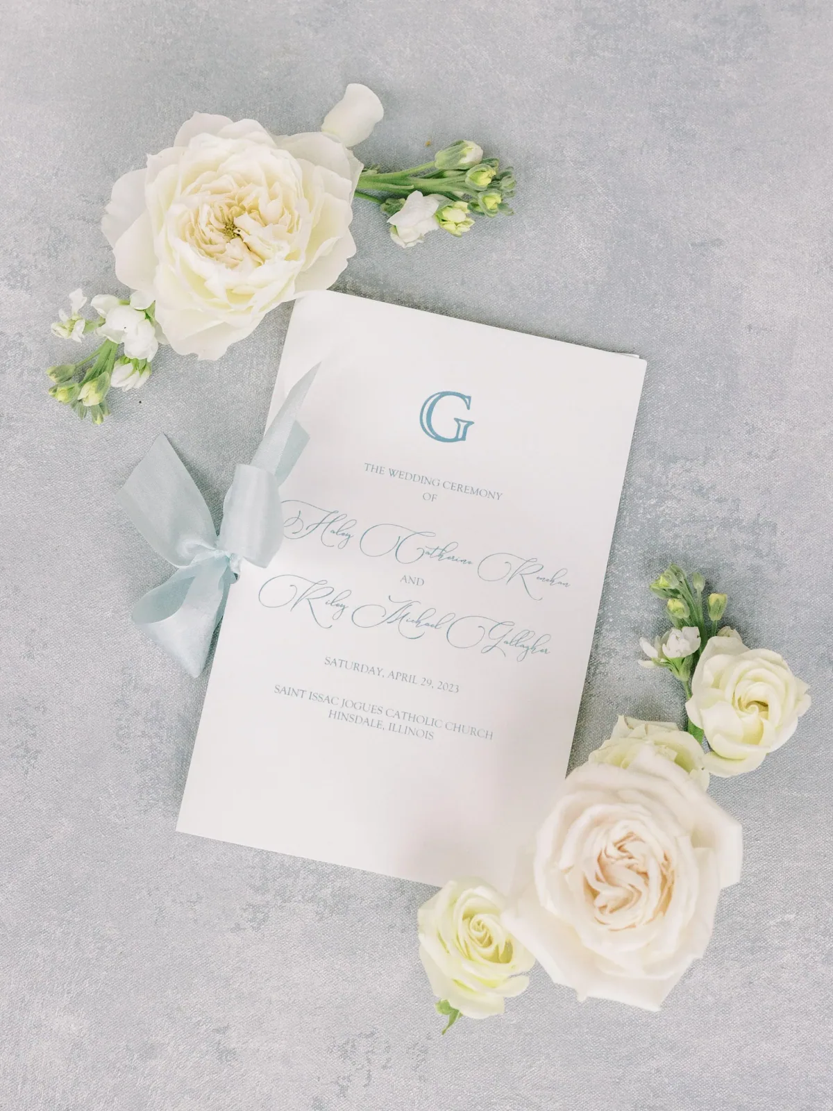 Ceremony program with white florals